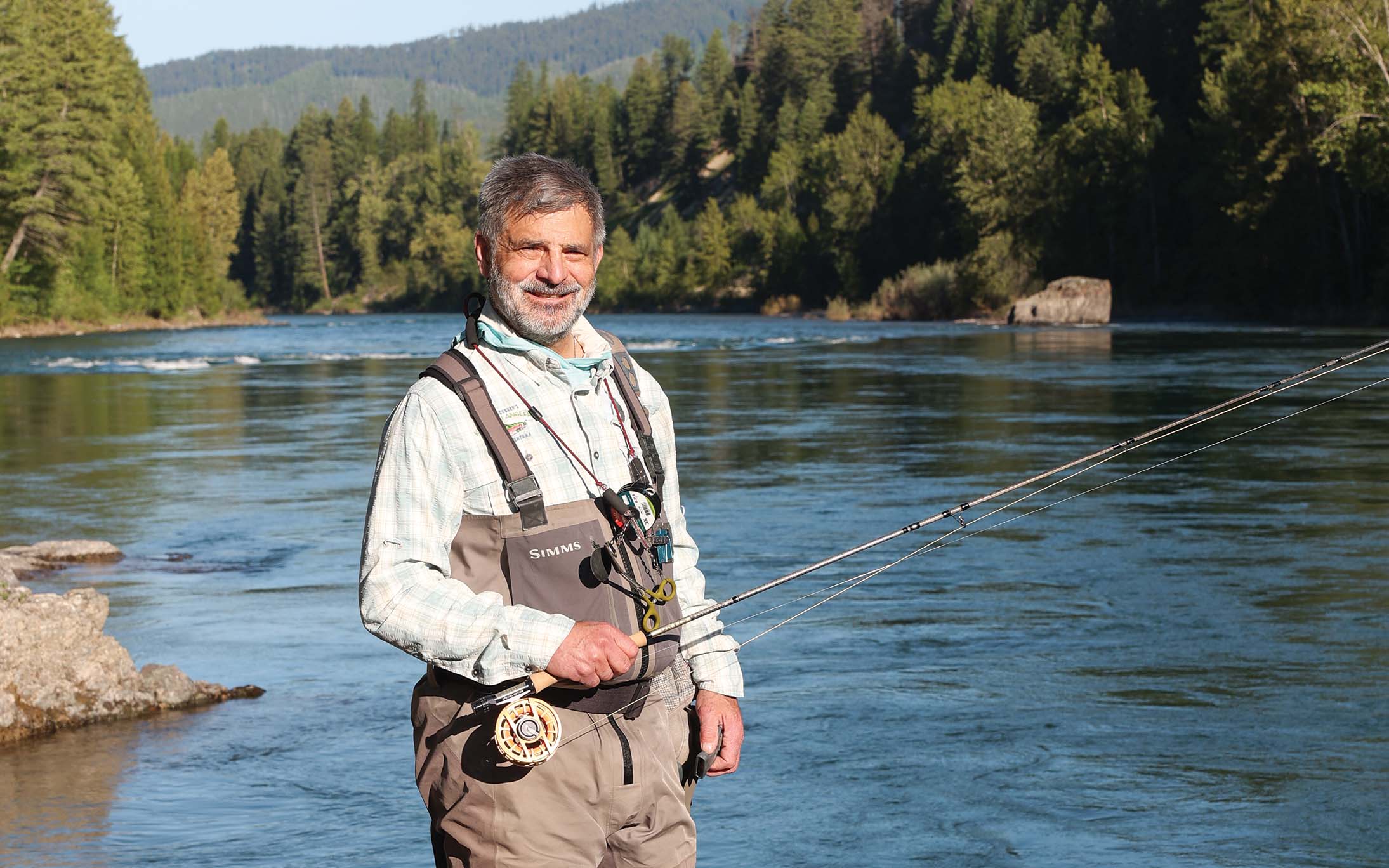 A.J. King, shown here in Montana with his dog, Luna, has been fly fishing for half a century. | Photo: Kelly Fitzgerald