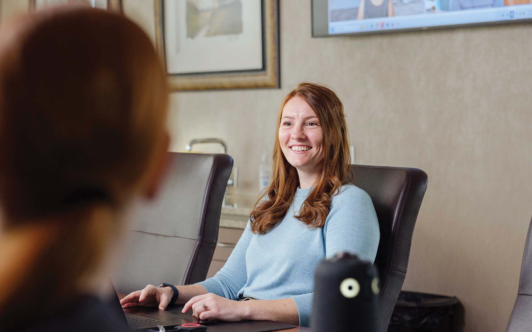 Erica Johnson of Dart Bank leads a hybrid meeting. The Michigan community bank has employees based in 33 states, with 30% in a hybrid work arrangement and more than 50% working remotely. | Photo: Steven Glynn