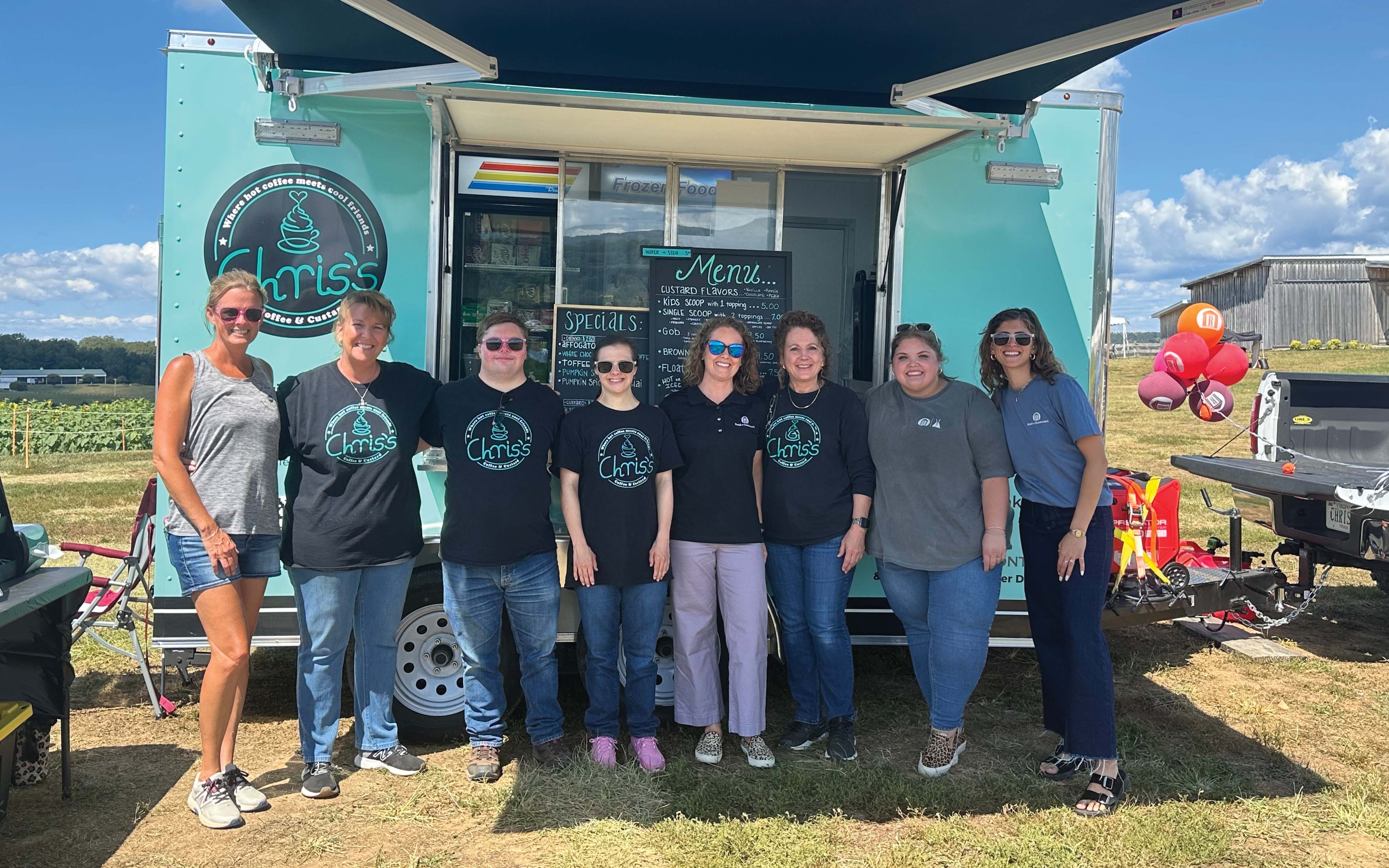 Bank of Botetourt employees with a vendor at the Beaver Dam Farm Sunflower Festival in 2025. | Photo courtesy of Bank of Botetourt