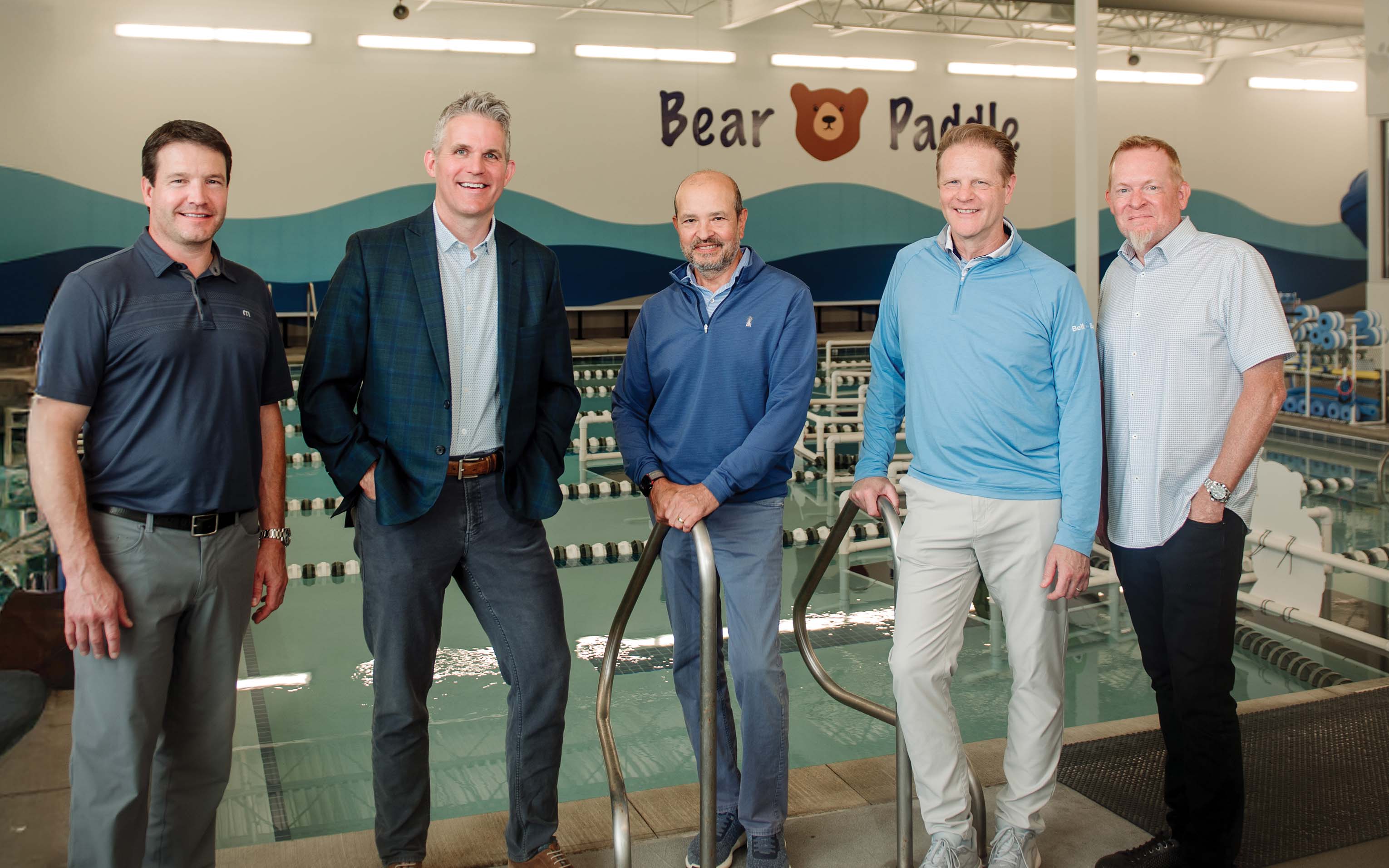 Bell Bank credits its accelerated growth to specialty financing. From left: Keith Crep and Todd Lee of Bell Bank, Peter Ahn of Hemisphere Investments, Paul Flood of Bell Bank, and John Reily, president and CEO of Bear Paddle Swim School, a Bell Bank client. | Photo by Becca Dilley